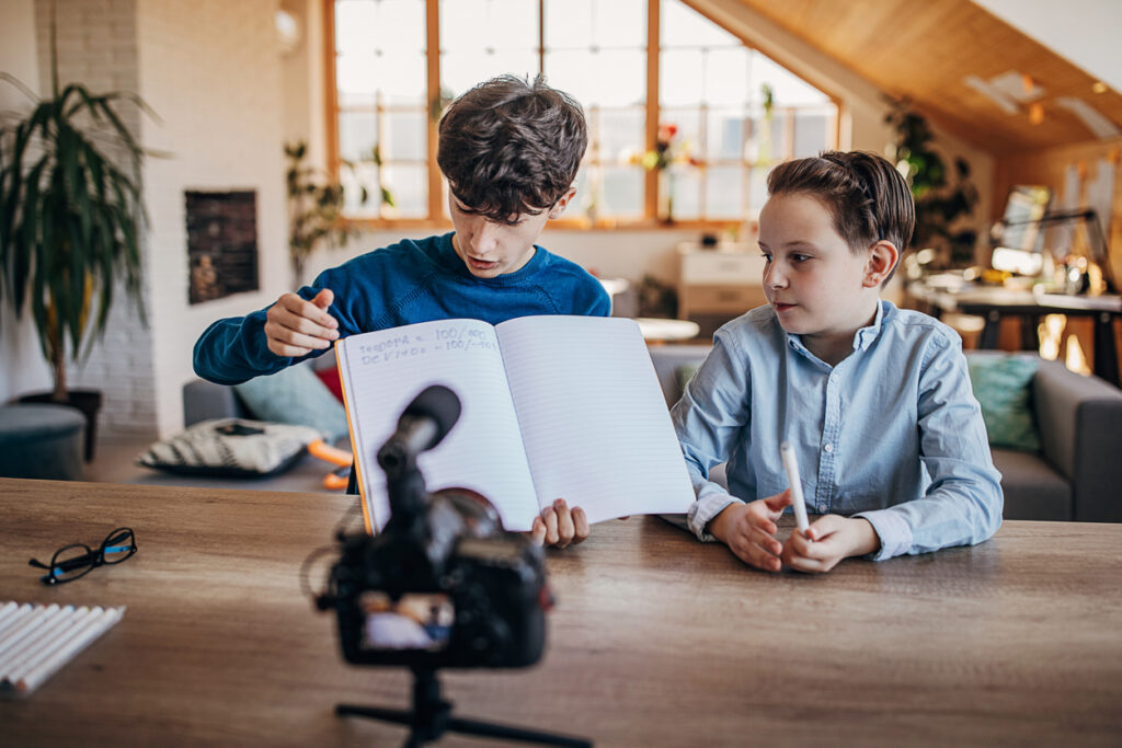 Two boys educational vlogging at home