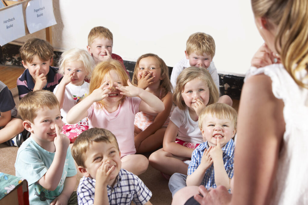 Montessori/Pre School Class Listening to Teacher