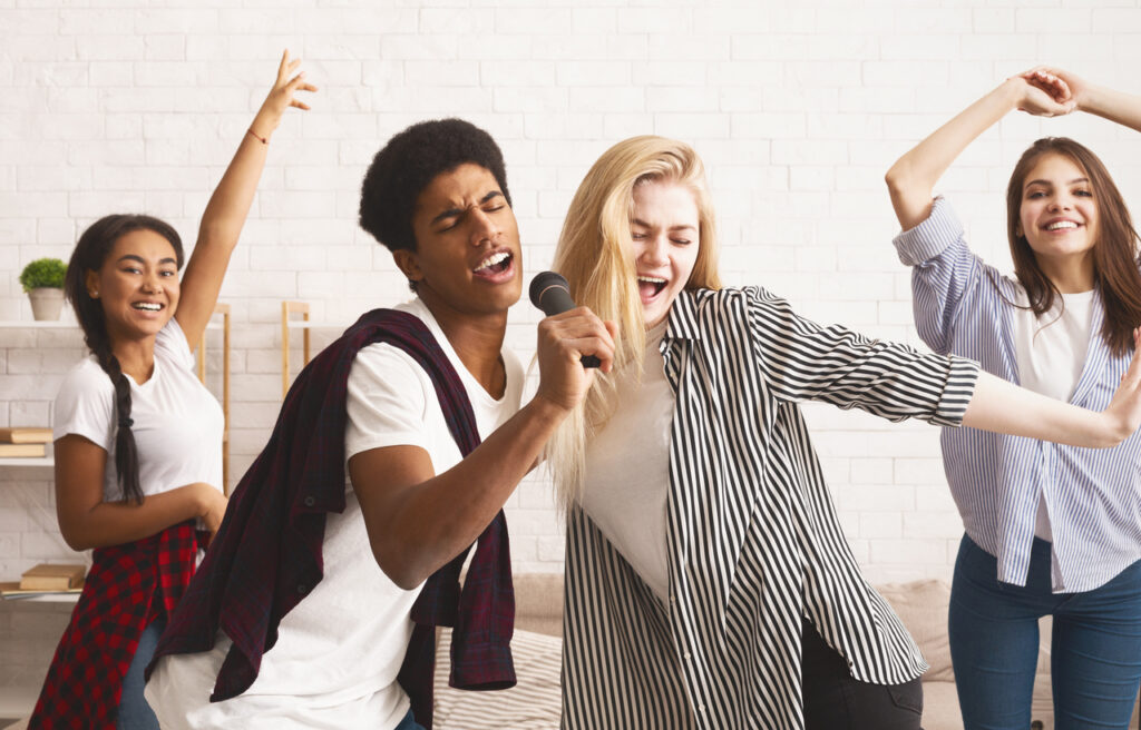 Teen students singing songs, spending time together